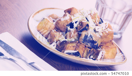 Plate with steamed eggplants with honey and cheese Plate with steamed eggplants with honey and cheese 54747010