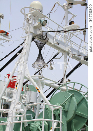 A fishing boat with a drum-shaped figurine showing fishing roar 54750800