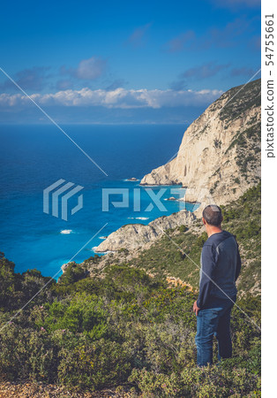 Tourist admiring view on the viewpoint above Tourist admiring view on the viewpoint above 54755661