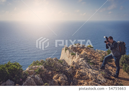 Tourist photographing Navagio Beach and Shipwreck Tourist photographing Navagio Beach and Shipwreck 54755663