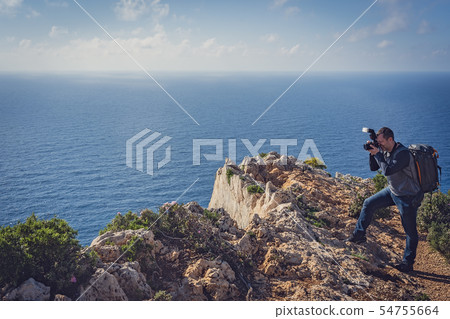 Tourist photographing Navagio Beach and Shipwreck Tourist photographing Navagio Beach and Shipwreck 54755664