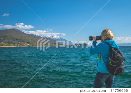 Female backpacker with a camera 54756666