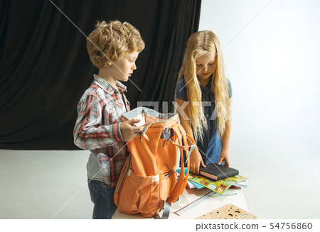 Boy and girl preparing for school after a long summer break. Back to school. 54756860