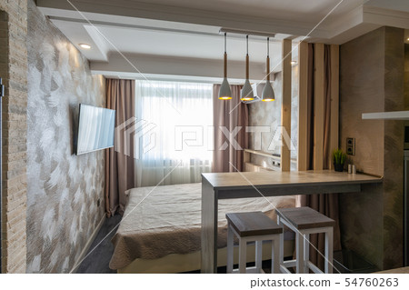 The interior of the hotel room, bed and bar The interior of the hotel room, bed and bar 54760263