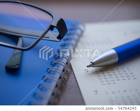Business image · calendar · notebook · glasses Business image · calendar · notebook · glasses 54764245