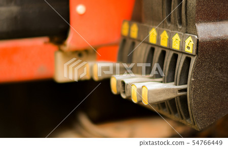 Technician hand is controlling the lifting crane. Technician hand is controlling the lifting crane. 54766449