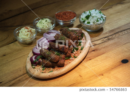 Classic kebabs on the plate. 54766863