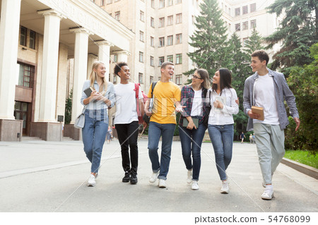 Free time of students, teens walking after passing test Free time of students, teens walking after passing test 54768099