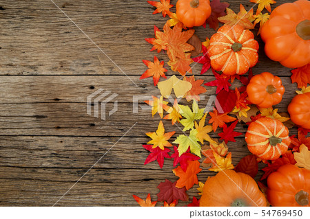 Autumn leaves on wooden background Autumn leaves on wooden background 54769450