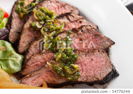 grilled tri tip steak with green onion sauce 54770249