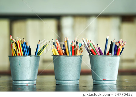 Closeup blunted color pencils in metal buckets Closeup blunted color pencils in metal buckets 54770432