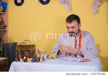 Potter making clay figure for board game Potter making clay figure for board game 54770590