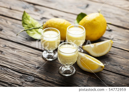 Traditional Italian liguore with lemon Traditional Italian liguore with lemon 54772959