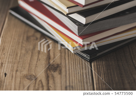 Books stacked on the desk 54773500