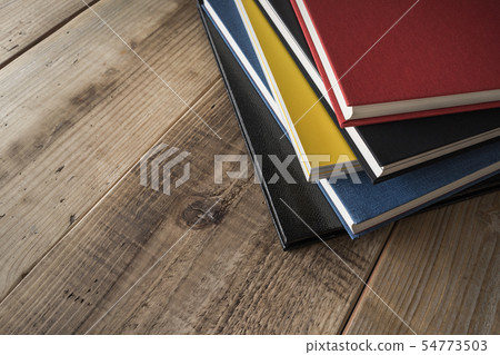 Books stacked on the desk 54773503