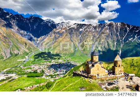 Gergeti Trinity Church under Mount Kazbegi in Georgia 54774629