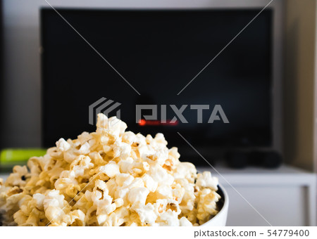 Black screen Smart TV and Popcorn bowl Black screen Smart TV and Popcorn bowl 54779400