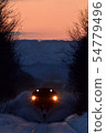 Snow plow at sunset 54779496