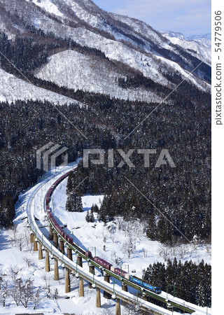 Freight train with clear snow Freight train with clear snow 54779506