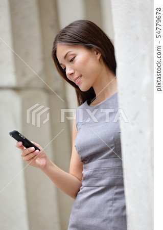 Smart business woman using app on smartphone 54779678
