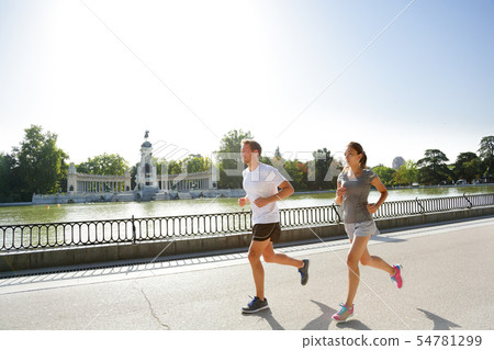 Runners jogging running in Madrid El Retiro park Runners jogging running in Madrid El Retiro park 54781299