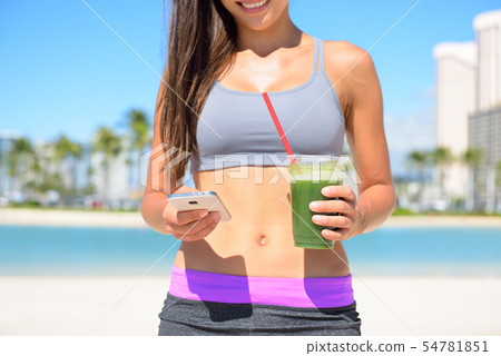 Woman drinking vegetable Green detox smoothie 54781851