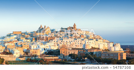 Ostuni white town skyline at sunrise 54787108