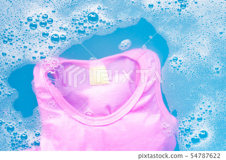 Pink kid sleeveless shirt soak in water 54787622