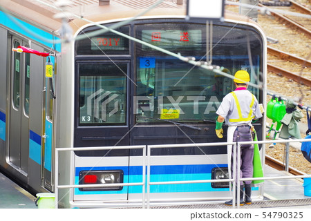Cleaning scenery of the train to stop at Mitaka vehicle center 54790325