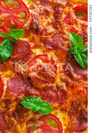 Homemade spicy pizza with sausage and tomato. Homemade spicy pizza with sausage and tomato. 54792162