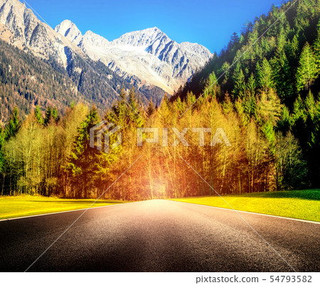 Mountain Road with blinding glare Mountain Road with blinding glare 54793582