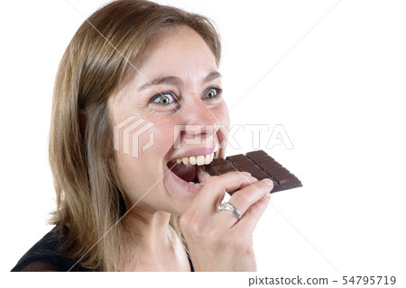 young woman eating chocolate 54795719