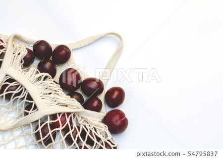 Plums in an ecological cotton reusable string bag, Plums in an ecological cotton reusable string bag, 54795837