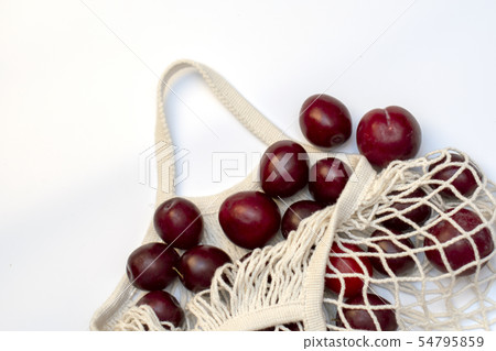Plums in an ecological cotton reusable string bag, Plums in an ecological cotton reusable string bag, 54795859
