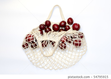 Plums in an ecological cotton reusable string bag, Plums in an ecological cotton reusable string bag, 54795915