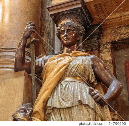 Statue of woman. Marble sculpture female bust. Caryatid stained sculpture adorns the old house 54796690