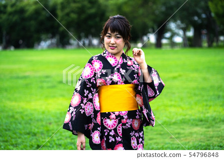 A woman in a yukata A woman in a yukata 54796848