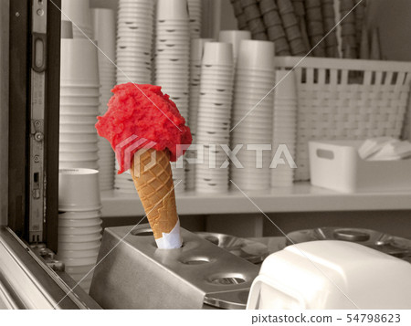 Strawberry or watermelon ice cream in waffle cone 54798623