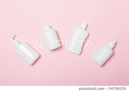 Set of White Cosmetic containers isolated on pink 54799258