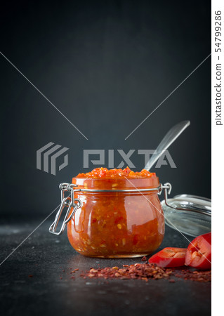 Traditional adjika hot chili pepper sauce paste. 54799286