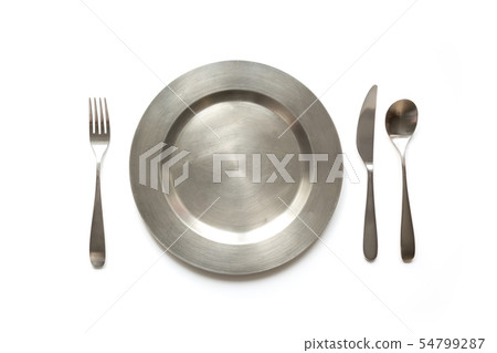 Empty metal dish with knife and fork on white. Empty metal dish with knife and fork on white. 54799287