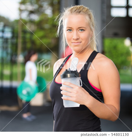 Woman rest and drinking water after workout Woman rest and drinking water after workout 54801130