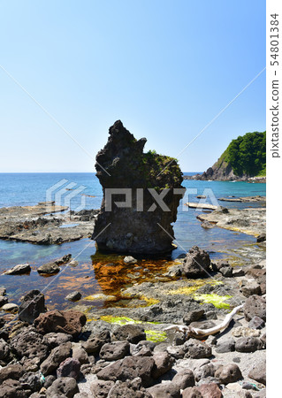 Taking a picture of the summer landscape of the raccoon rocks on the sunny Hokkaido town of Nagasu beach Taking a picture of the summer landscape of the raccoon rocks on the sunny Hokkaido town of Nagasu beach 54801384