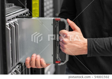 Close-up of IT consultant install blade Server in datacenter 54801502