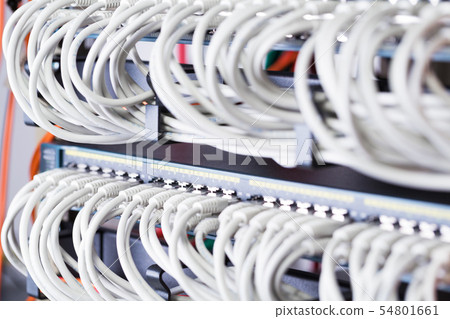 Gigabit network switch and perfect aligned patch cables in datacenter 54801661