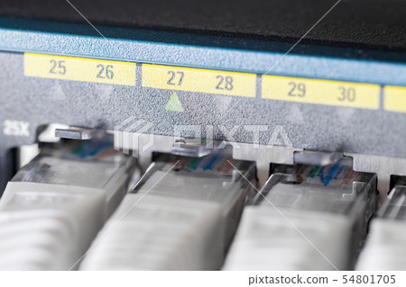 Close-up of high speed network switch and cables in datacenter 54801705