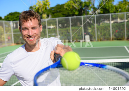 Tennis player portrait man showing ball and racket Tennis player portrait man showing ball and racket 54801892