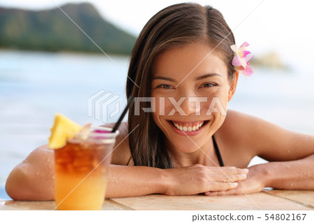 Hawaii woman with hawaiian Mai Tai drink on beach 54802167