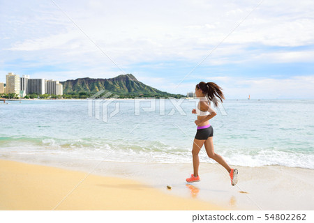 Woman runner - running fitness girl beach jogging Woman runner - running fitness girl beach jogging 54802262