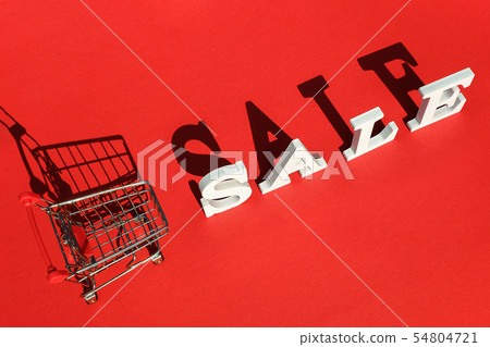 Small empty shopping trolley cart and word SALE of 54804721
